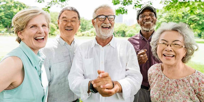 A group of older people, smiling at the camera.