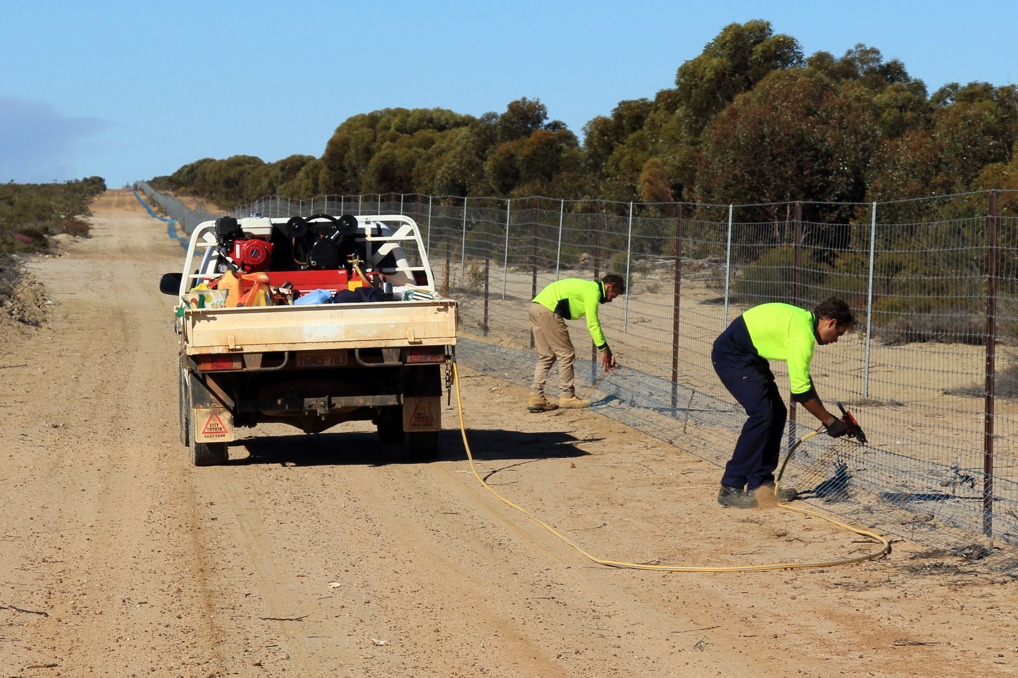 Indigenous contractors working on remote fencing