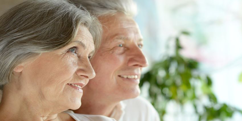 Elderly couple looking into the distance