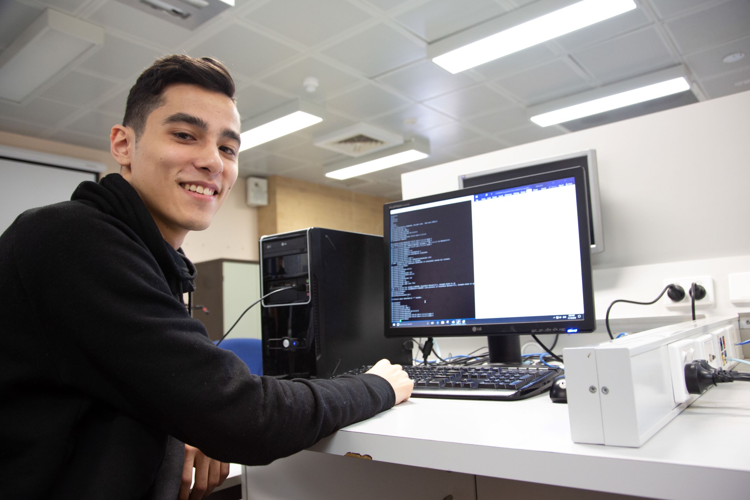 TAFE student sitting at computer