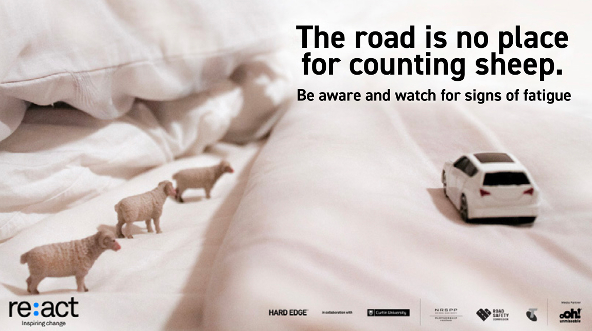 The road is no place for counting sheep banner. Car on bed with sheep