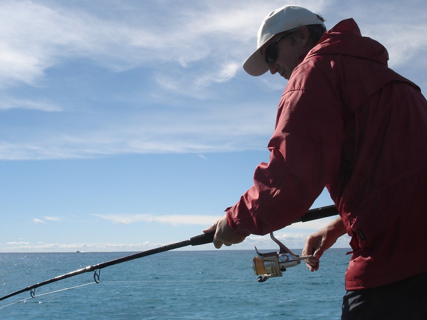 Man fishing in ocean