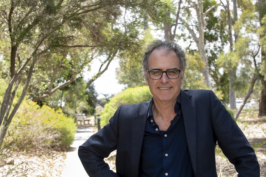 Man standing in front of trees