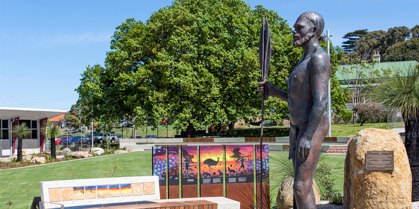 Mokare statue and Aboriginal art displayed at a park