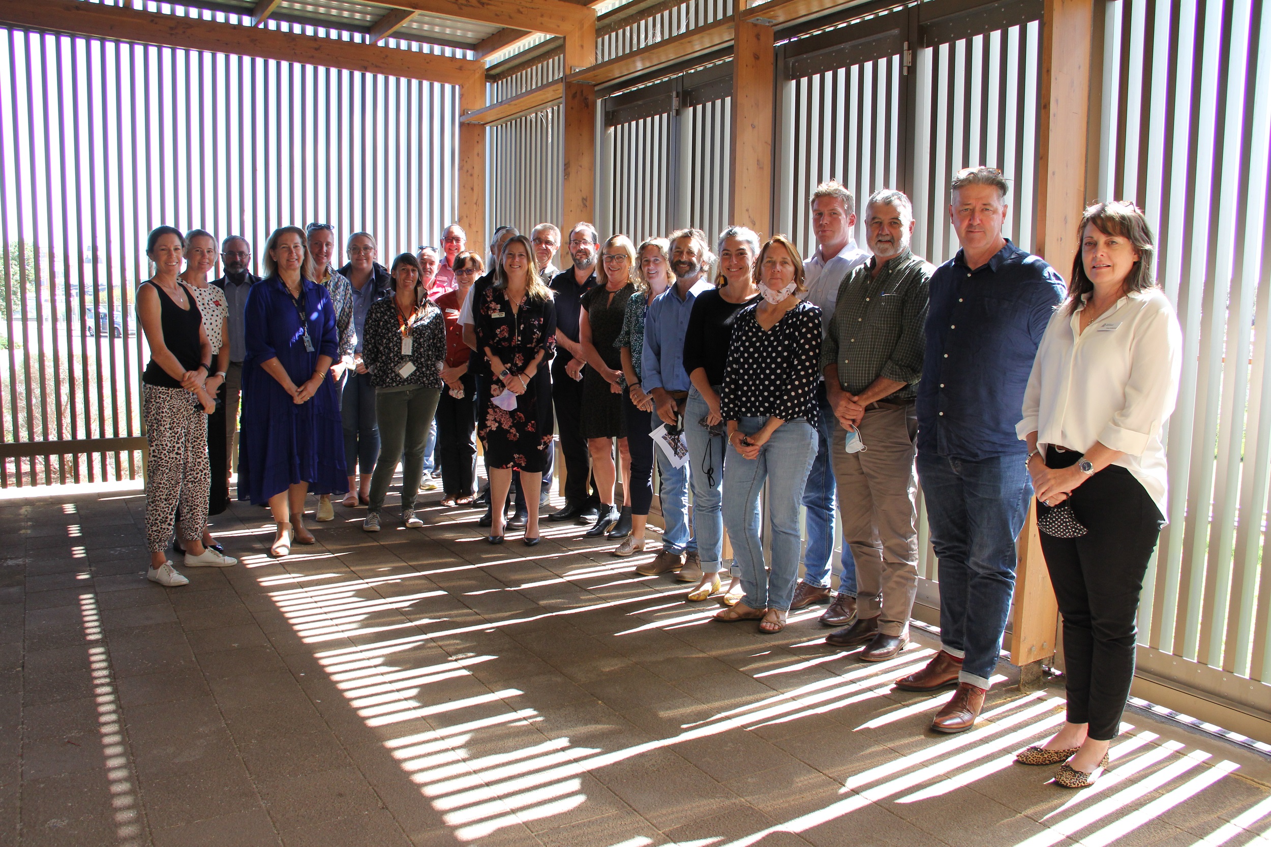 23 members of DPIRD staff standing in farm shed for photo opportunity