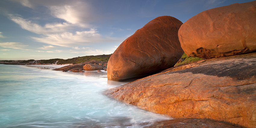 Red boulders by the ocean