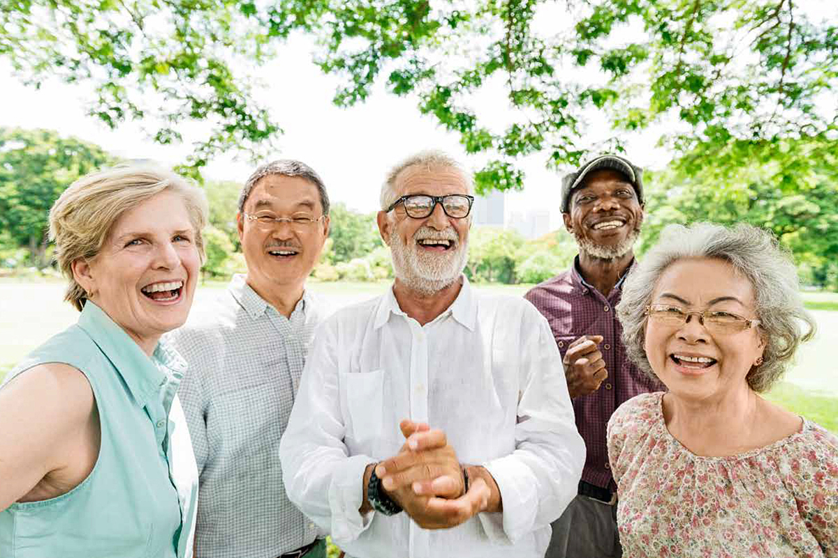 A group of older people, smiling at the camera.