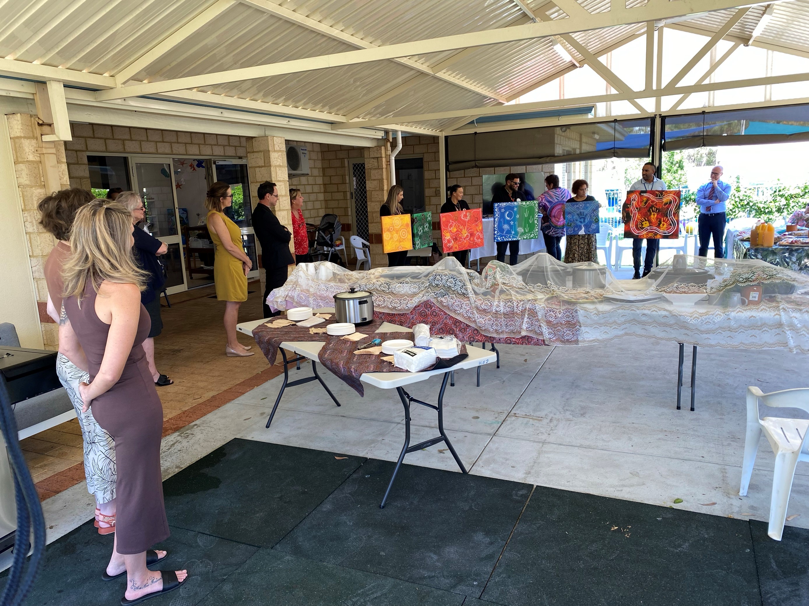 Photo of Communities Director General Mike Rowe at a gathering with Aboriginal Artists in Mandurah