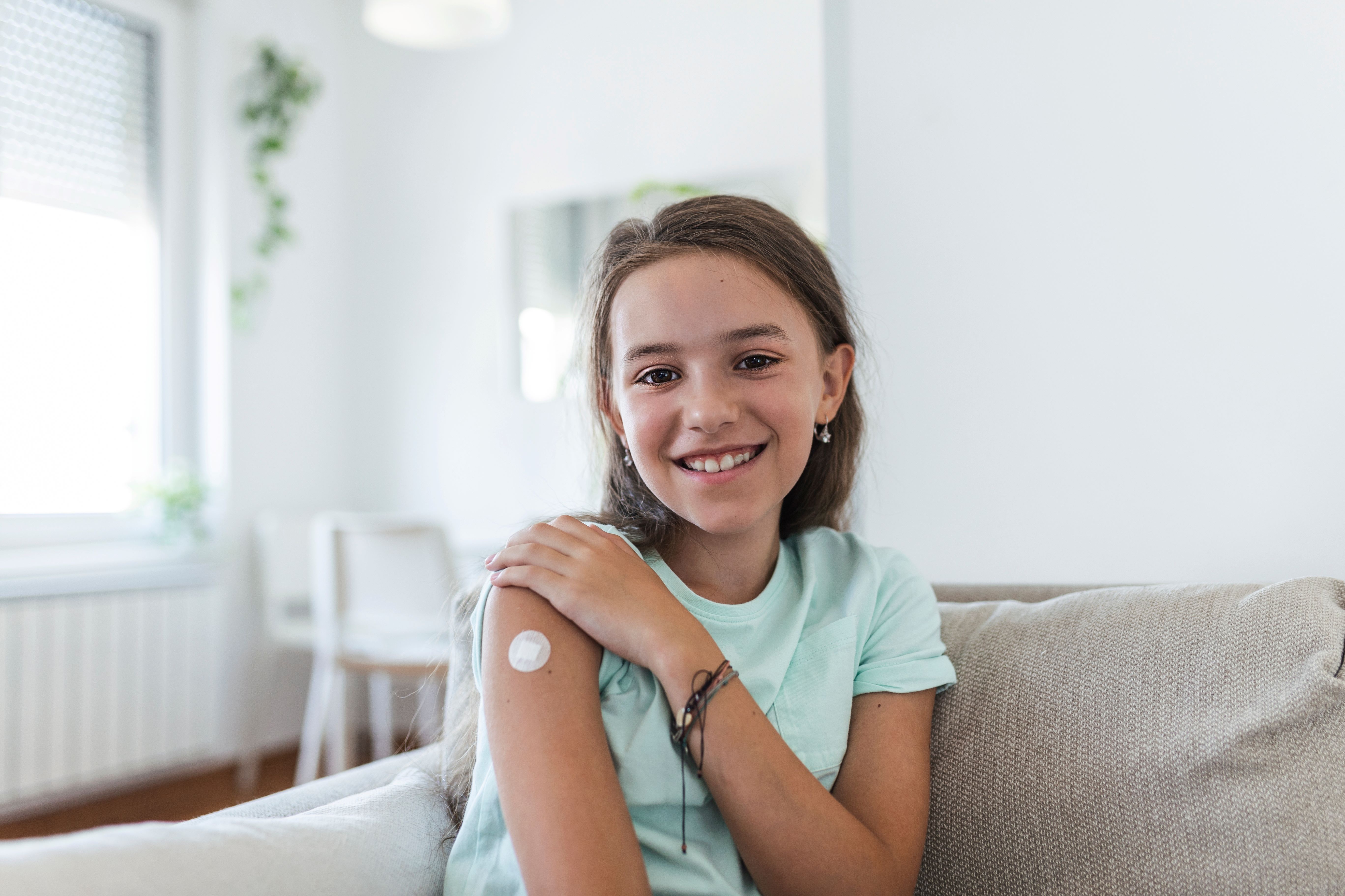 Free flu vaccinations for Western Australians throughout May and June 2024 announcement. Image: girl who has received vaccine.