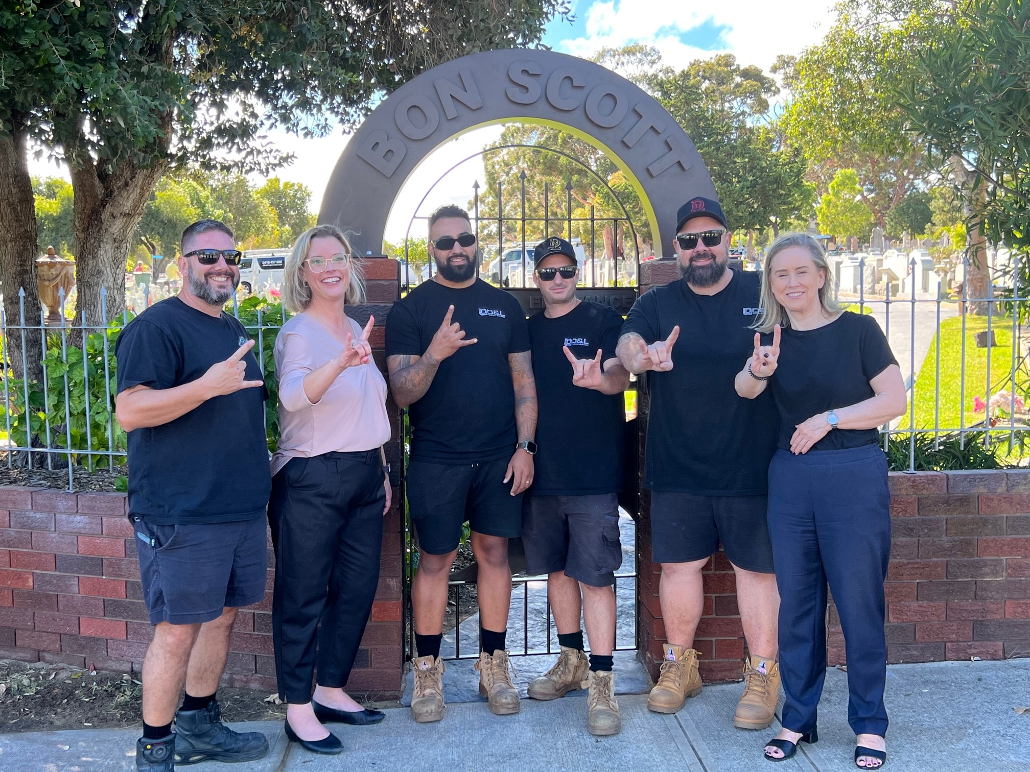 Our Minister the Hon. Hannah Beazley together with the Hon. Simone McGurk and D&S Service crew standing in front of the restored gate.