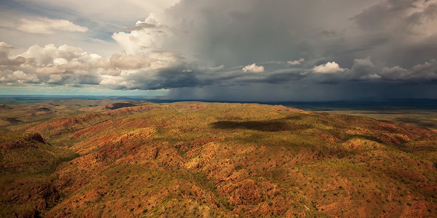 clouds over a sparsely vegetated Western Australian landscape to inspire use of climate projections for water and climate change resources in WA