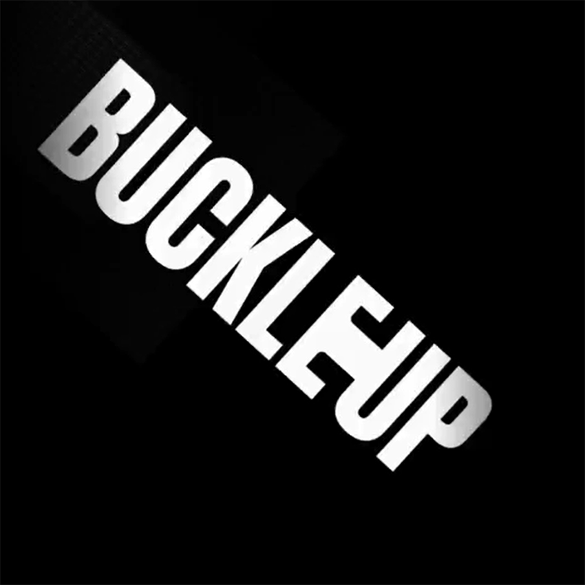 White text saying 'Buckle up' on black background