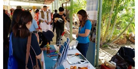 Communications Officer Sarah Johnston with visitors to stall