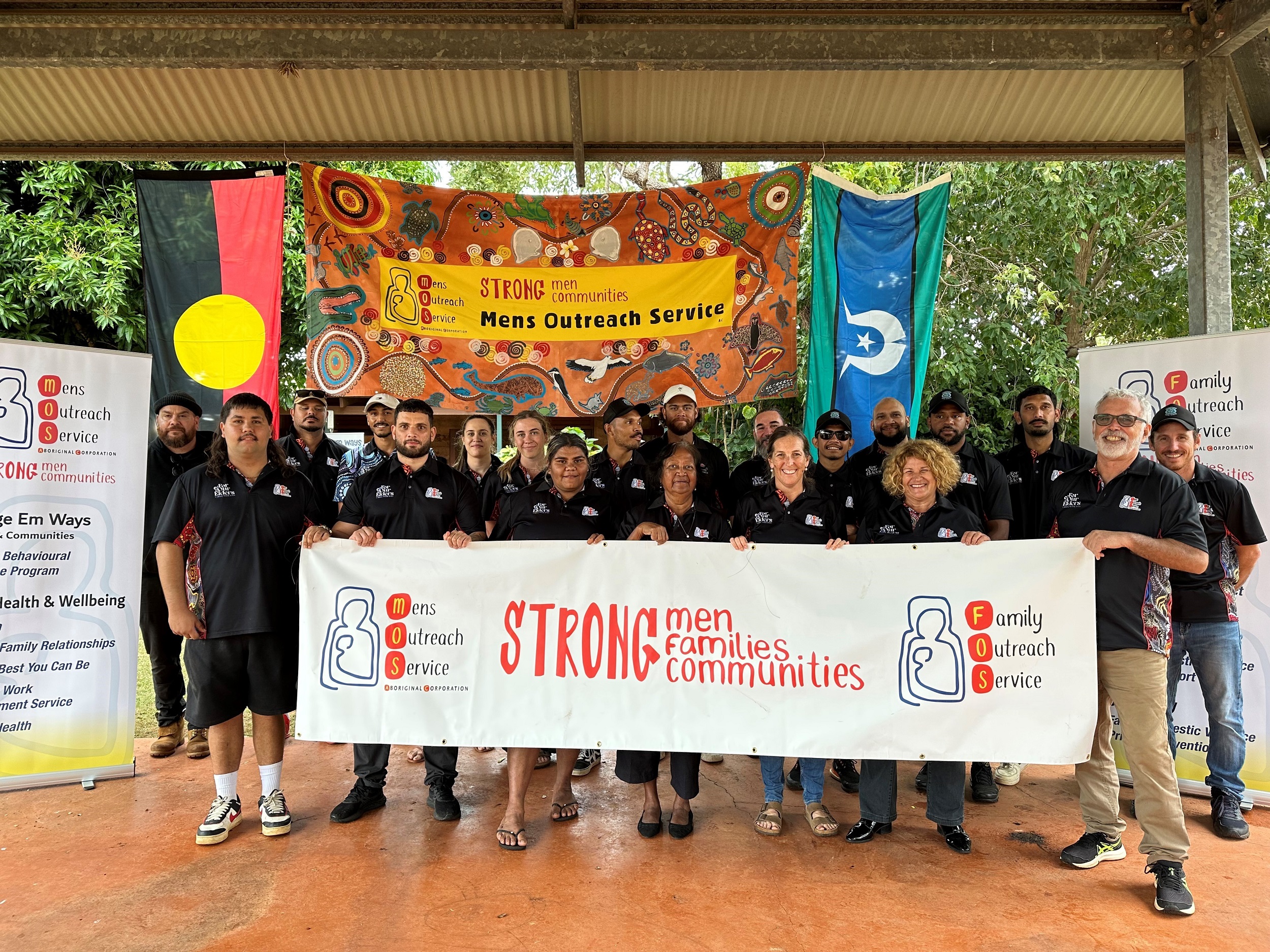 Photo of a group of staff from the Mens Outreach Service Aboriginal Corporation during their NAIDOC event in 2023.