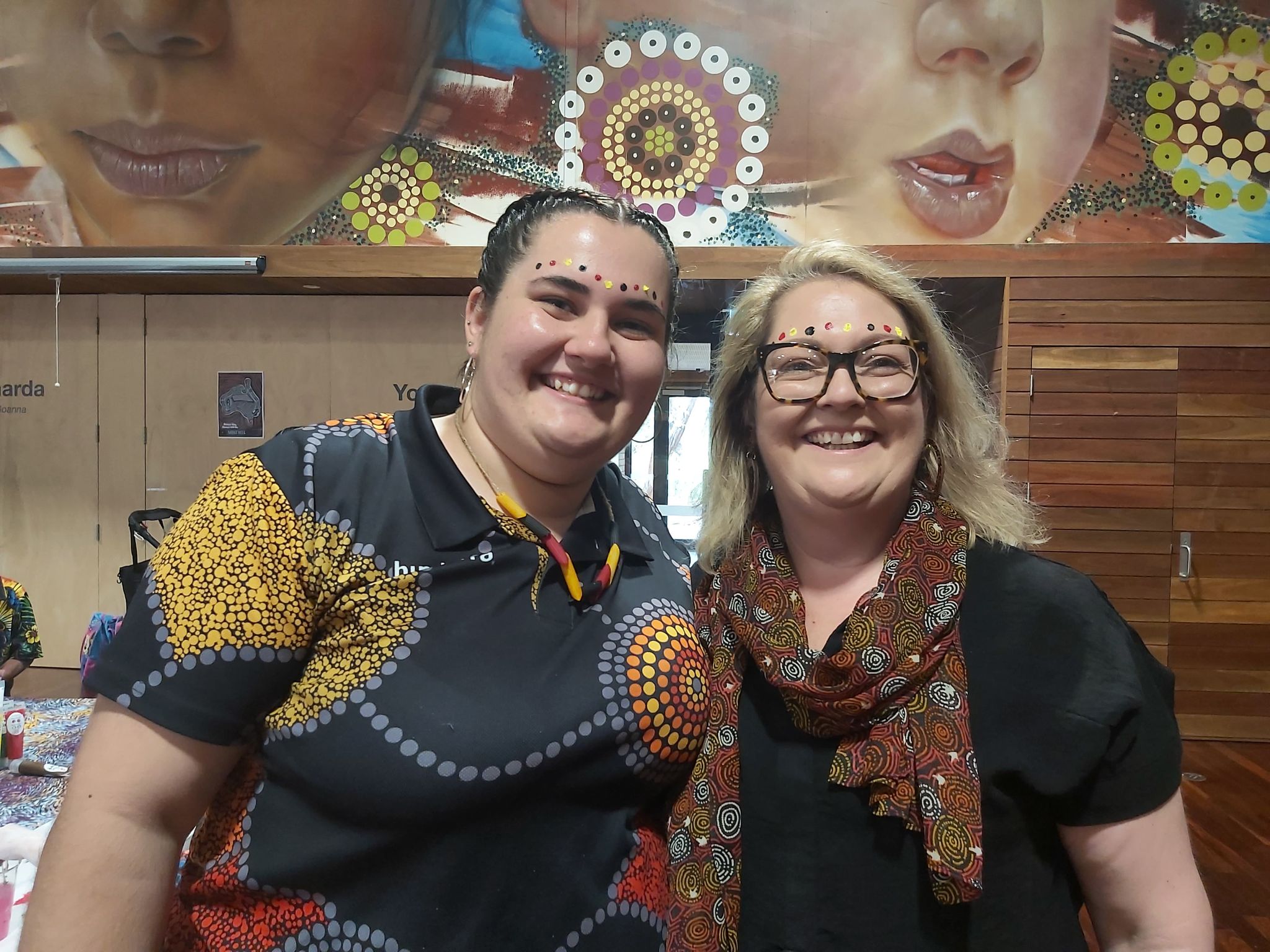 photo two Communities staff members Emmerson and Lauren Lawrence in an office setting