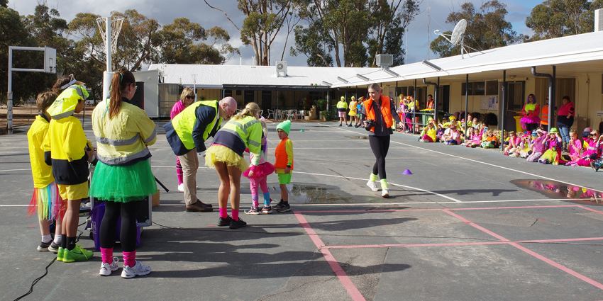 Adrian giving out prizes for best fluoro gear at Narembeen School