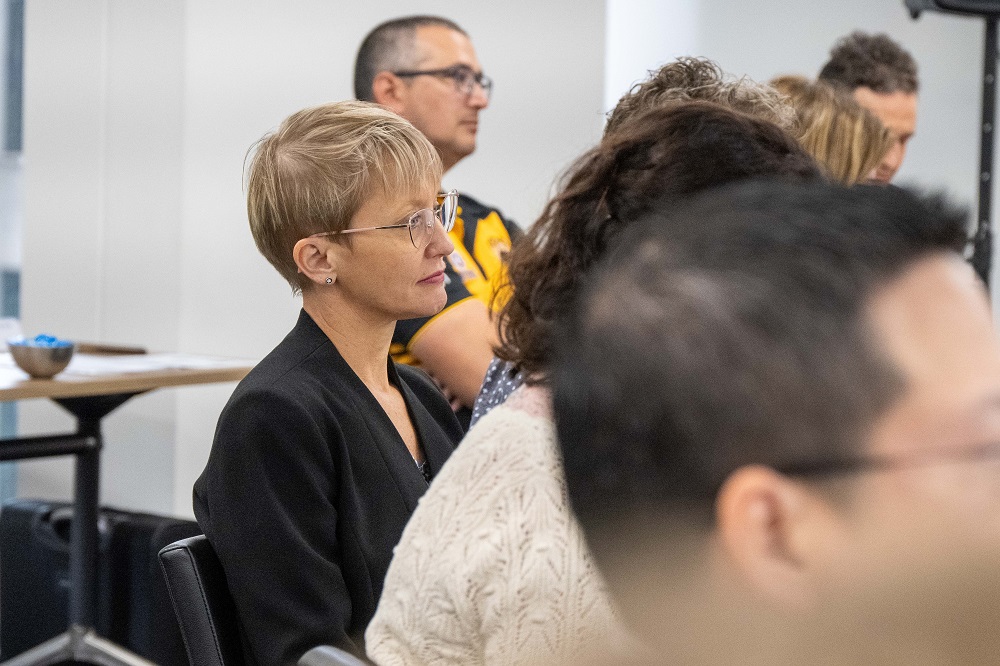 Participant in the Elev8 Insightful Leader session listening to the presenter