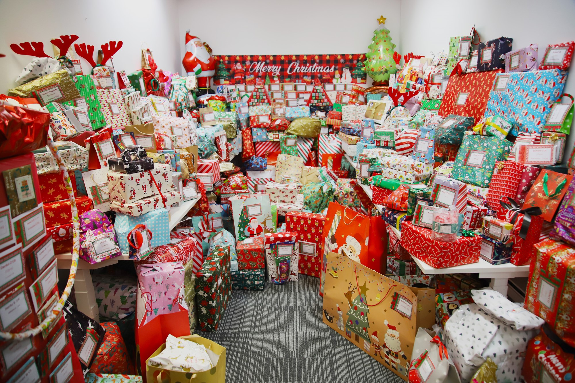 Image of a room full of hundreds of presents