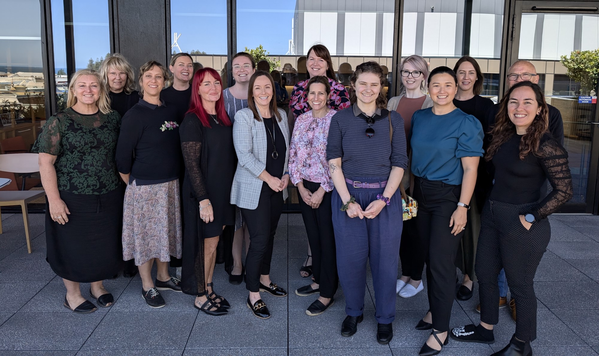 Group photo of about 15 Department of Communities staff 