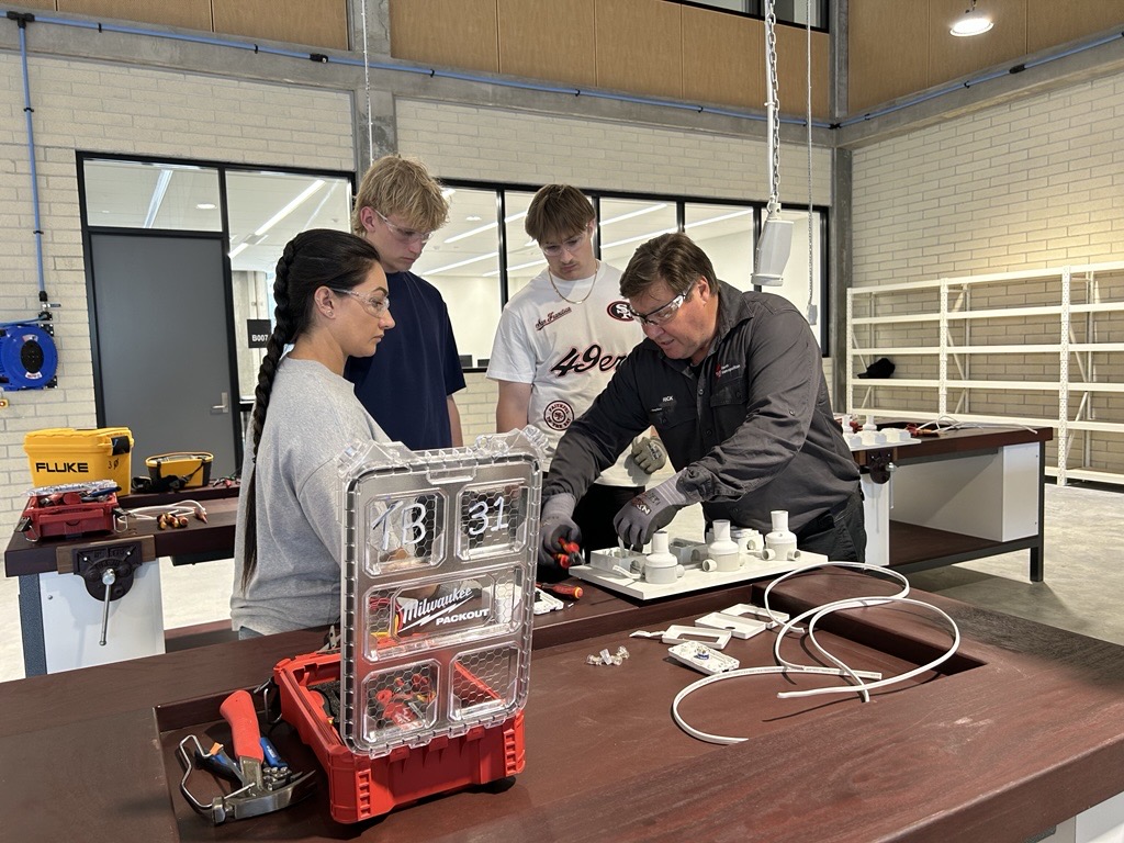 Students at TAFE with lecturer.