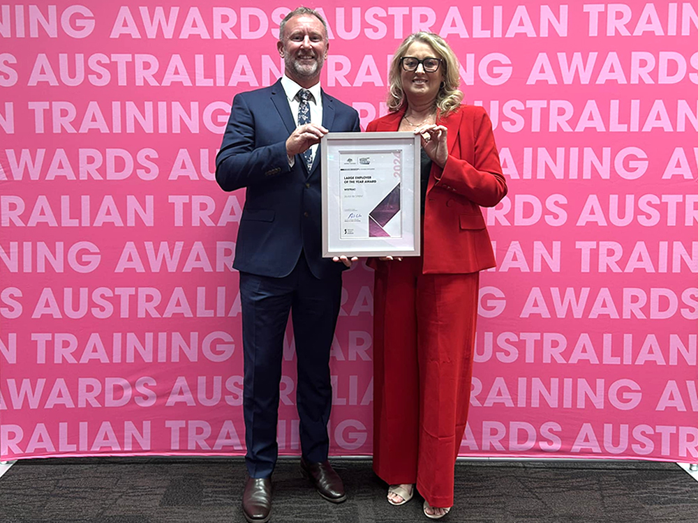 Jeremy and Kylie from Westrac, with their Silver certificate for Large Employer of the Year from the Australian Training Awards