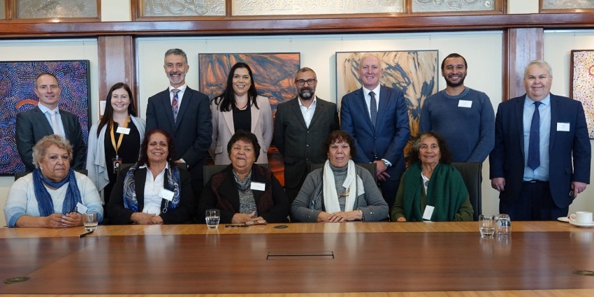 Photograph of Minister Dawson, Minister Buti, SWALSC Board and Executives and Noongar Elders at the signing ceremony in the Aboriginal Peoples Room at Parliament House
