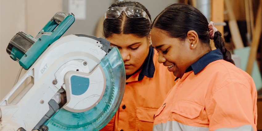 Two young Aboriginal women learning a trade with fee-free training.