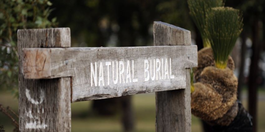 the wooden natural burial sign bordering the natural burial area at Fremantle Cemetery