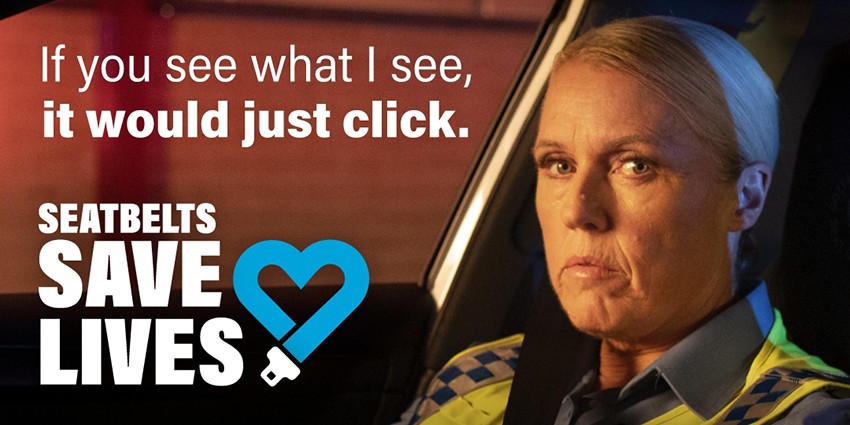 A policewoman looks at the camera. Next to her are the words 'If you see what I see, it would just click. Seatbelts save lives'.