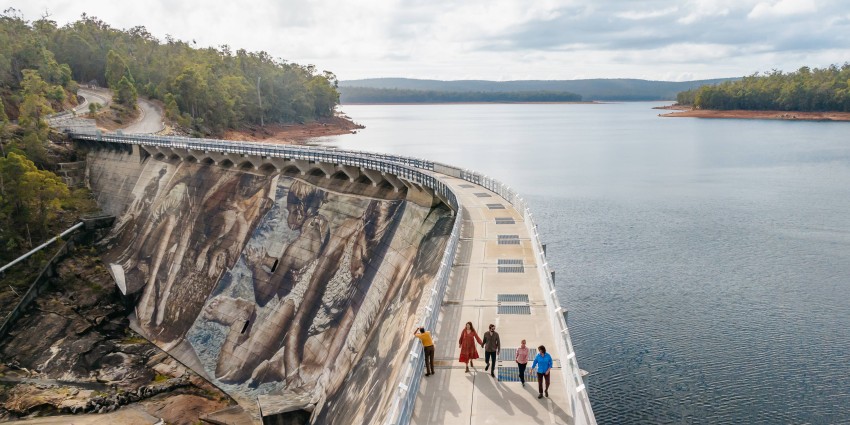 Ariel view of Collie dam with people walking on the path above