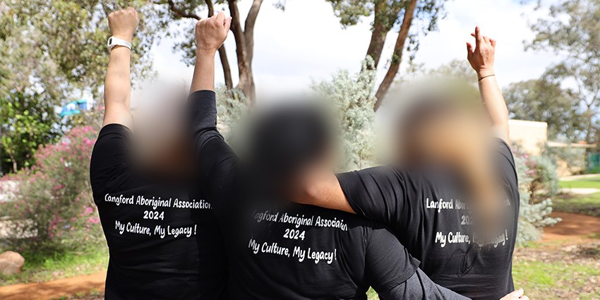 3 women celebrating completion of the National Empowerment Project