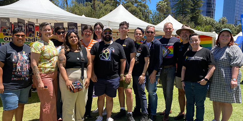 Department of Communities staff outside the Pride WA Fairday marquee.