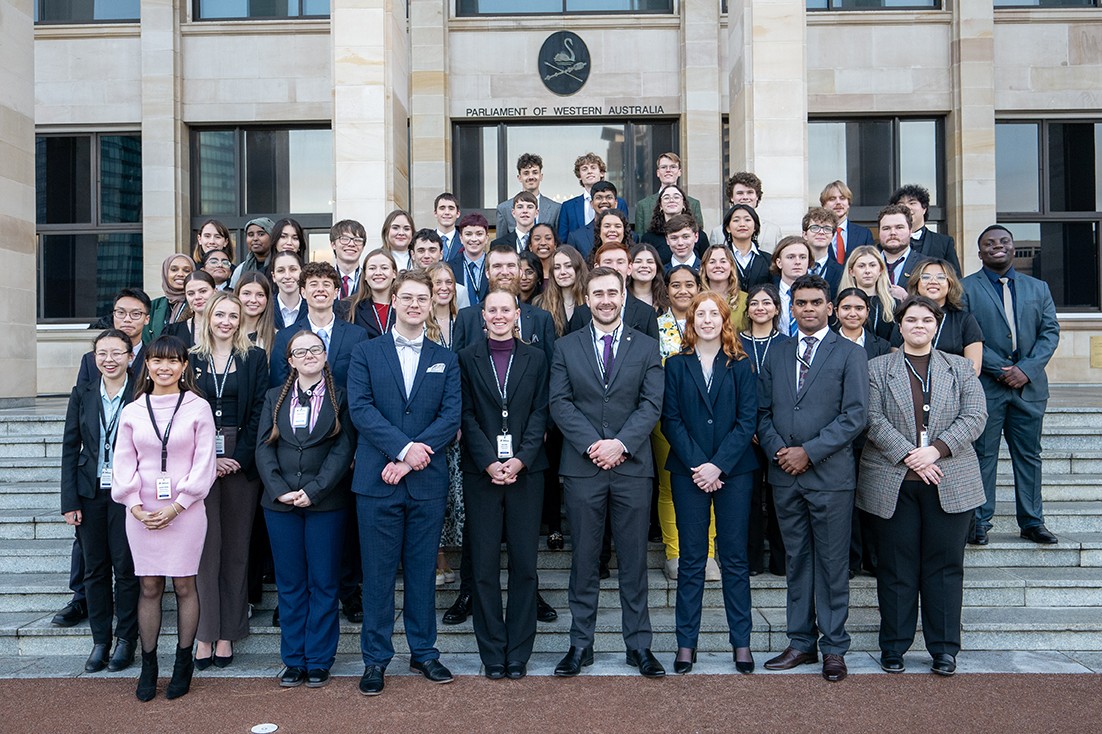 A group photo of the 2024 Youth Parliament standing in front of the Parliament of Western Australia.